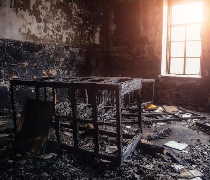 "interior view of a room with items completely destroyed by fire"